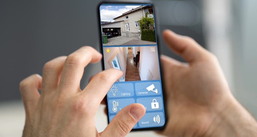 Resident looking at surveillance camera feeds on a mobile device